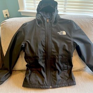 The North Face girl’s black rain coat with hood and cozy fleece lining